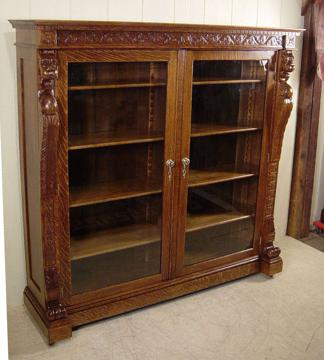 Oak Two-Door Bookcase with Lion Heads