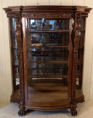 Serpentine Glass Oak China Cabinet with Lion Heads