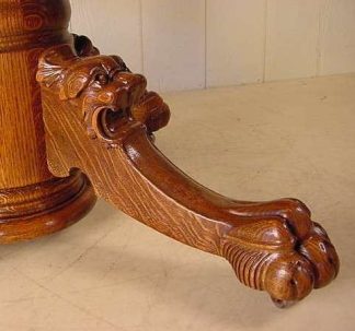 54" HASTINGS TABLE CO. ROUND OAK CLAW FOOT TABLE W/ LION HEADS