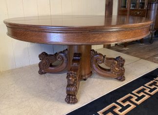 60" Round Oak Dining Table with Lion Heads & 9 original leaves