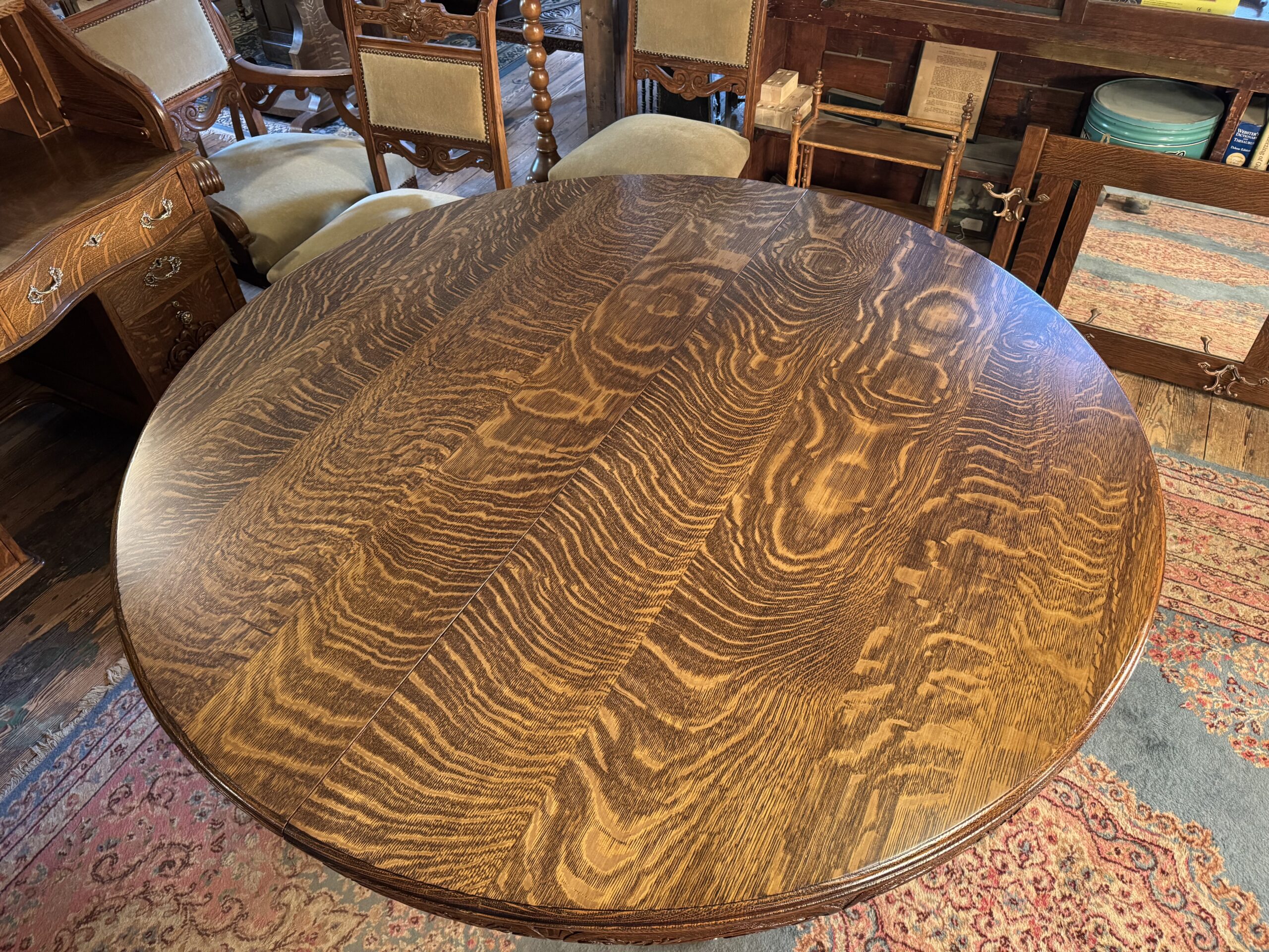 Exceptional 60" Round Oak Dining Table with Carved Apron & 5 original leaves - Image 9