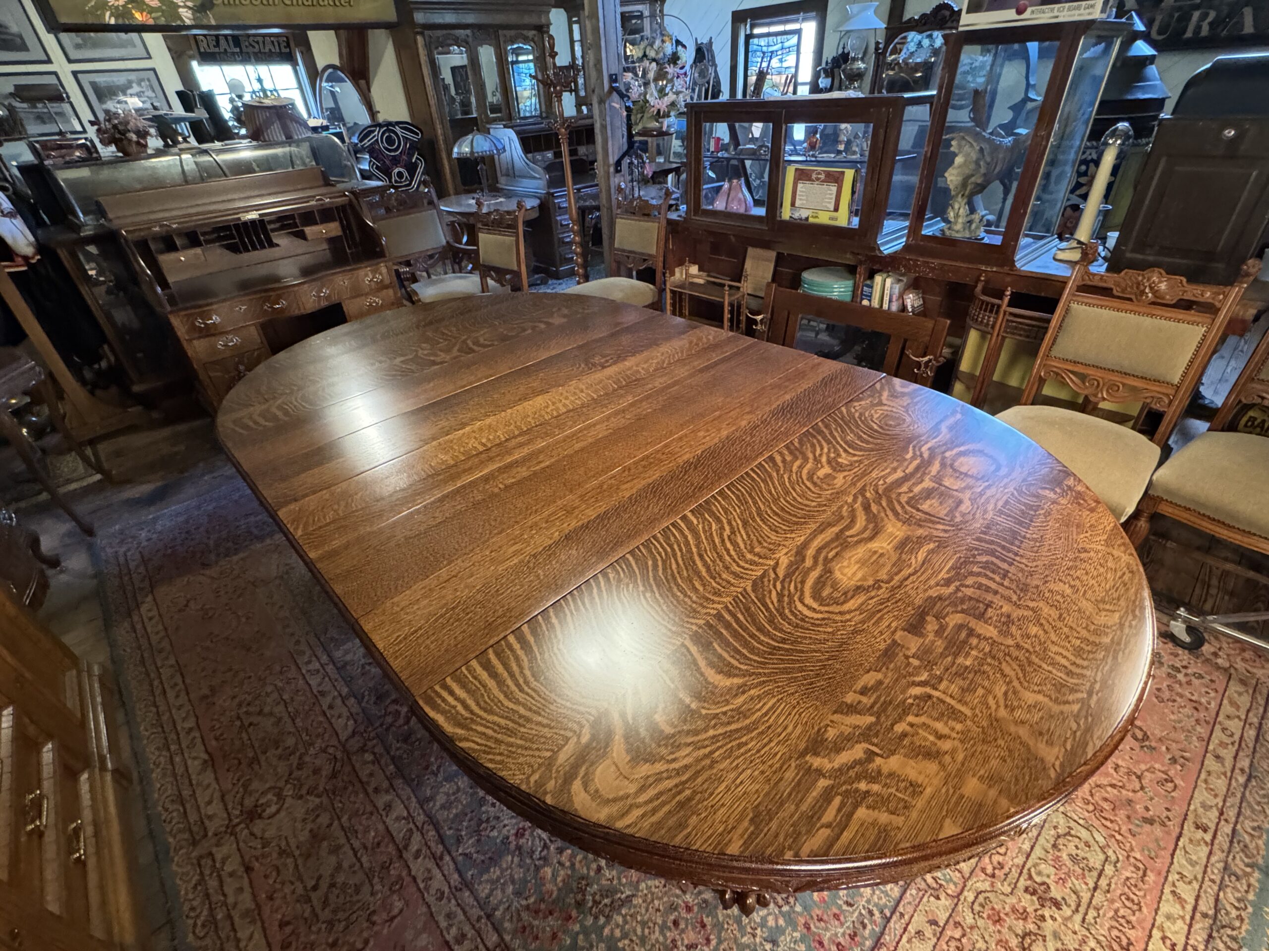 Exceptional 60" Round Oak Dining Table with Carved Apron & 5 original leaves - Image 12