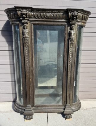 Oak Curved Glass China Cabinet with Carved Men