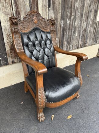 Carved Oak Upholstered Chair with Lion Heads